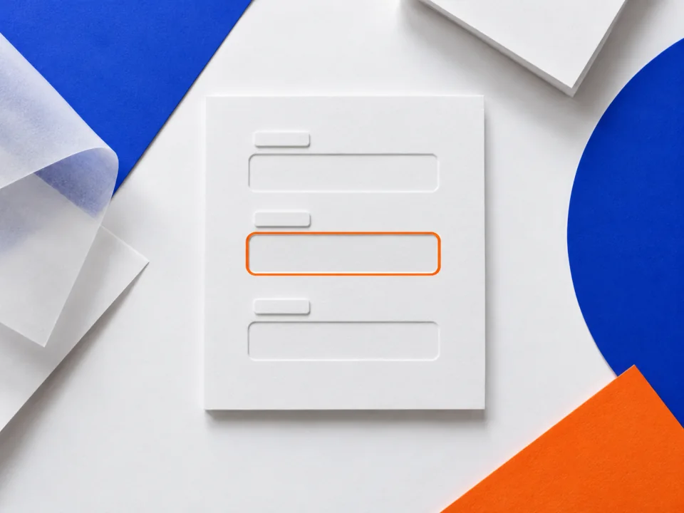 A blank paper form with three embossed fields, one outlined in orange.